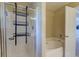 A bright bathroom with a shower, a jetted tub, and a door leading to the next room at 3073 Penny Ln, Johns Island, SC 29455