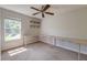 Bedroom with neutral carpet, a ceiling fan, built-in desk and natural light at 3073 Penny Ln, Johns Island, SC 29455