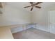 Bedroom with neutral carpet, a ceiling fan, and built-in desk area at 3073 Penny Ln, Johns Island, SC 29455