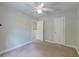 Cozy bedroom features neutral carpet, ceiling fan and a double door closet at 3073 Penny Ln, Johns Island, SC 29455