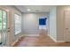Bright bonus room with hardwood floors, plenty of natural light, and arched doorway accents at 3073 Penny Ln, Johns Island, SC 29455