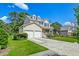Charming two-story home featuring a two-car garage, front porch, and well-maintained landscaping at 3073 Penny Ln, Johns Island, SC 29455