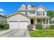 Attractive two-story home with a two-car garage and inviting front porch with flower boxes at 3073 Penny Ln, Johns Island, SC 29455