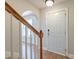 View of the foyer featuring hardwood floors, staircase with wooden handrail, and an arched doorway at 3073 Penny Ln, Johns Island, SC 29455