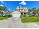 Charming two-story home featuring a two car garage, porch, and well manicured lawn at 3073 Penny Ln, Johns Island, SC 29455