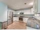 Modern kitchen with stainless steel appliances, granite countertops, and ample cabinet space at 3073 Penny Ln, Johns Island, SC 29455
