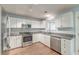 Well-equipped kitchen with stainless steel appliances, granite countertops, and white cabinets at 3073 Penny Ln, Johns Island, SC 29455