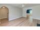 Bright living room with wood floors, arched doorways and a modern ceiling fan at 3073 Penny Ln, Johns Island, SC 29455