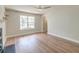 Bright living room featuring hardwood floors, a ceiling fan, fireplace and an arched doorway at 3073 Penny Ln, Johns Island, SC 29455