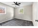 Carpeted bedroom with two windows and a ceiling fan at 315 Elliott Dr, Ladson, SC 29456