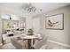 Cozy dining area with modern table and decor that transitions into a living space at 315 Elliott Dr, Ladson, SC 29456