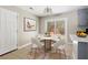 Dining area with round table set, stylish decor and sliding glass doors leading to the backyard at 315 Elliott Dr, Ladson, SC 29456