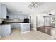 Open kitchen with an island, a black refrigerator, and tiled flooring at 315 Elliott Dr, Ladson, SC 29456