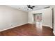 Open living room featuring hardwood floors and a ceiling fan, leading to outdoor patio access at 315 Elliott Dr, Ladson, SC 29456