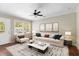 Comfortable living room filled with natural light, featuring a modern sofa and stylish accents at 315 Elliott Dr, Ladson, SC 29456