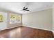 Bright, empty living room with hardwood floors and a ceiling fan, ready for personalization at 315 Elliott Dr, Ladson, SC 29456