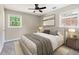 Bedroom with two windows, neutral decor, and carpeted floors at 315 Elliott Dr, Ladson, SC 29456