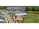 Scenic aerial shot of the community pool, playground, and lake near a neighborhood of attractive homes at 318 Ripple Park Dr, Summerville, SC 29486