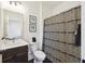 Bright bathroom with a decorative shower curtain, floating vanity, and modern fixtures at 318 Ripple Park Dr, Summerville, SC 29486