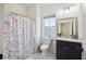 Bright bathroom featuring a vanity and a shower with a decorative curtain at 318 Ripple Park Dr, Summerville, SC 29486