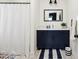 This bathroom has a modern vanity and shower with decorative touches at 318 Ripple Park Dr, Summerville, SC 29486