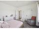 Inviting bedroom with a charming chair, dresser, and ample natural light at 318 Ripple Park Dr, Summerville, SC 29486