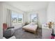 Cozy bedroom with neutral decor, a comfortable chair, and a large window at 318 Ripple Park Dr, Summerville, SC 29486