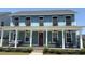Charming blue two-story home with a welcoming front porch, swing, and red front door at 318 Ripple Park Dr, Summerville, SC 29486