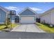 Detached two car garage with a basketball hoop at 318 Ripple Park Dr, Summerville, SC 29486