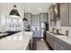 Well-equipped kitchen with a spacious island, stainless steel appliances, modern finishes, and ample cabinet space at 318 Ripple Park Dr, Summerville, SC 29486