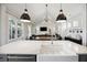 Bright, open-concept kitchen featuring a large island and sink overlooking the living room at 318 Ripple Park Dr, Summerville, SC 29486