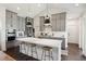 Modern kitchen with gray cabinets, a large island, and counter seating at 318 Ripple Park Dr, Summerville, SC 29486