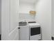 Clean and efficient laundry room with modern appliances and shelving at 318 Ripple Park Dr, Summerville, SC 29486