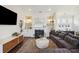 Comfortable living room featuring a fireplace, built-in shelving, a sectional sofa, and stylish decorative touches at 318 Ripple Park Dr, Summerville, SC 29486