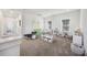 Spacious playroom filled with toys and natural light from two windows at 318 Ripple Park Dr, Summerville, SC 29486