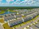 Extensive view of a planned community with townhomes, a lake and manicured lawns at 326 Surfbird Rd # 388, Summerville, SC 29486