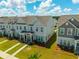 Aerial shot of townhomes showcasing green spaces and organized community layout at 326 Surfbird Rd # 388, Summerville, SC 29486