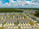 Scenic aerial view of townhomes with dedicated parking in a community surrounded by mature trees and manicured lawns at 326 Surfbird Rd # 388, Summerville, SC 29486