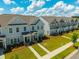 An elevated view of a neighborhood featuring modern townhomes and green landscaping at 326 Surfbird Rd # 388, Summerville, SC 29486