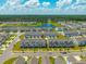 Scenic aerial view of townhomes in a lakeside community with lush green landscaping and tree lined border at 326 Surfbird Rd # 388, Summerville, SC 29486