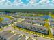Beautiful aerial view of townhomes in a lakeside community surrounded by lush green lawns and tree lined border at 326 Surfbird Rd # 388, Summerville, SC 29486