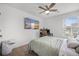 A bright bedroom featuring a ceiling fan, mounted TV, and a dedicated workspace at 326 Surfbird Rd # 388, Summerville, SC 29486