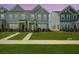 Charming townhome with gray siding, well-manicured lawn and sidewalks leading to covered entryway at 326 Surfbird Rd # 388, Summerville, SC 29486