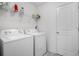 Functional laundry room with modern washer and dryer, shelving, and storage at 326 Surfbird Rd # 388, Summerville, SC 29486