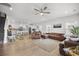 Open concept living space with hardwood floors, white walls, a ceiling fan and updated kitchen at 326 Surfbird Rd # 388, Summerville, SC 29486