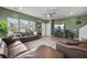 Cozy living room featuring hardwood floors, a ceiling fan, a large TV and comfortable couches at 326 Surfbird Rd # 388, Summerville, SC 29486