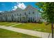 Attractive townhomes with well-kept lawns create a pleasing residential streetscape at 326 Surfbird Rd # 388, Summerville, SC 29486