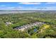 Aerial view showing neighborhood homes surrounded by lush greenery and a nearby pond at 3751 Copahee Sound Dr, Mount Pleasant, SC 29466