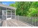Large back deck with white railings, overlooking a lush green backyard, perfect for outdoor living at 3751 Copahee Sound Dr, Mount Pleasant, SC 29466