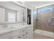 Stylish bathroom with double vanity, walk-in closet access, and a sleek glass shower at 3751 Copahee Sound Dr, Mount Pleasant, SC 29466